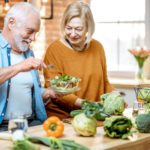 Senior couple with healthy food at home